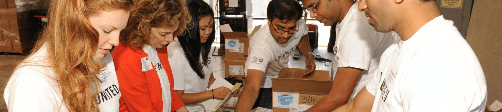 Group of people organize children's books