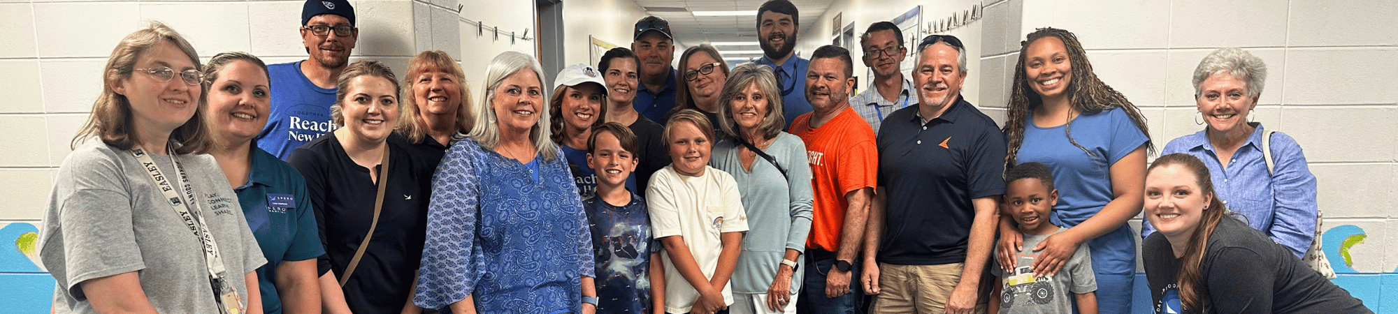 a group of people smile at the camera
