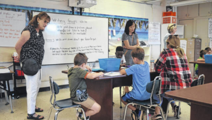 Julie Capaldi, left, in a class room at Camp iRock’s campus in Pickens at Pickens Elem.